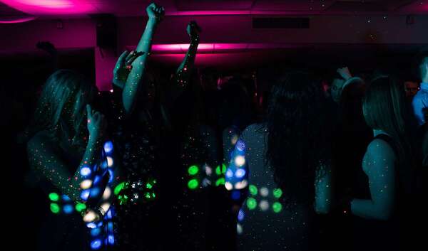 Adult birthday disco with guests dancing